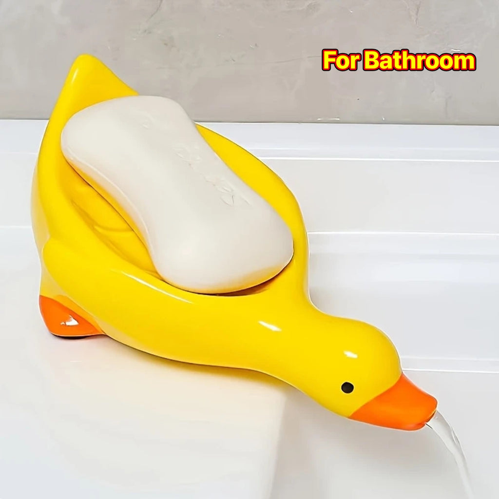 Yellow and White Duck-shaped Soap Dish with an Oval Bathroom Drainage Tray Featuring an Anti-water Accumulation Design. A Gift Suitable for All 4 Seasons, Combining Creativity and Practicality. It Serves as Both a Soap Holder and a Storage for Small