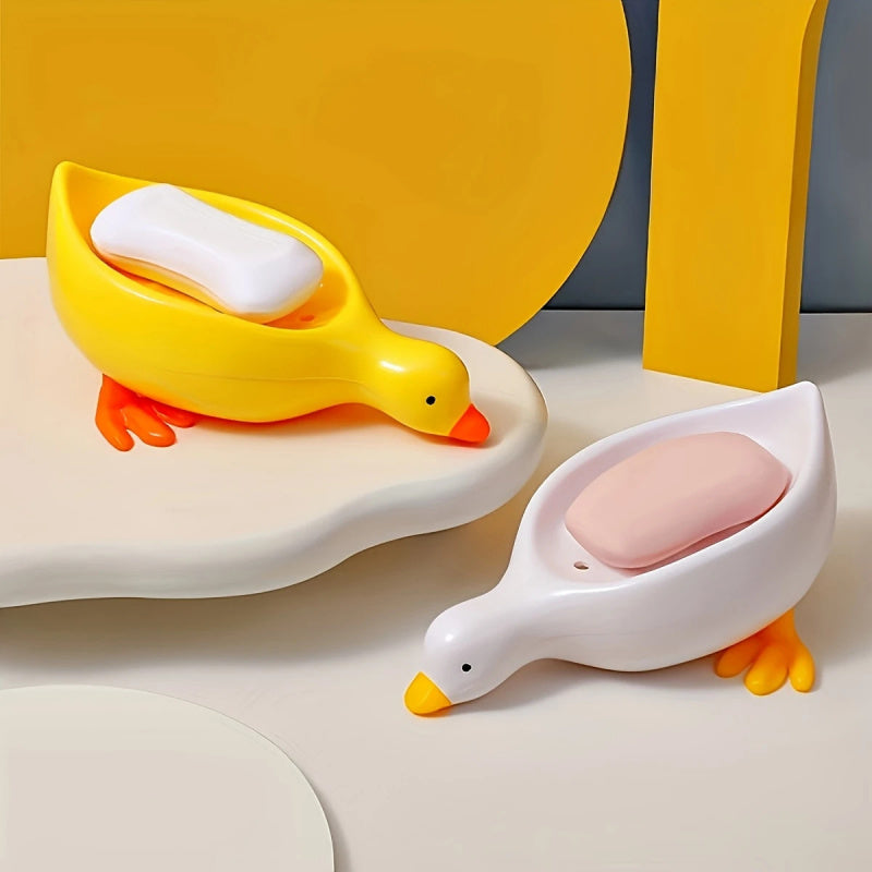 Yellow and White Duck-shaped Soap Dish with an Oval Bathroom Drainage Tray Featuring an Anti-water Accumulation Design. A Gift Suitable for All 4 Seasons, Combining Creativity and Practicality. It Serves as Both a Soap Holder and a Storage for Small