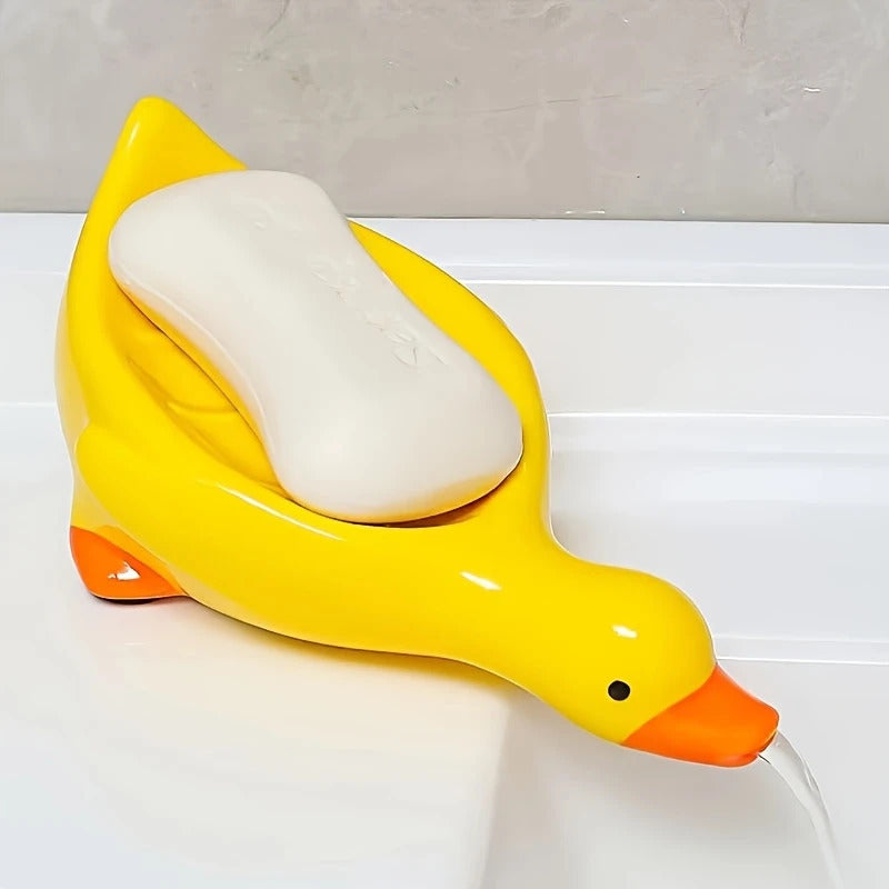 Yellow and White Duck-shaped Soap Dish with an Oval Bathroom Drainage Tray Featuring an Anti-water Accumulation Design. A Gift Suitable for All 4 Seasons, Combining Creativity and Practicality. It Serves as Both a Soap Holder and a Storage for Small