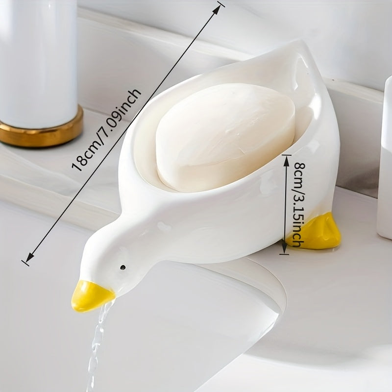 Yellow and White Duck-shaped Soap Dish with an Oval Bathroom Drainage Tray Featuring an Anti-water Accumulation Design. A Gift Suitable for All 4 Seasons, Combining Creativity and Practicality. It Serves as Both a Soap Holder and a Storage for Small